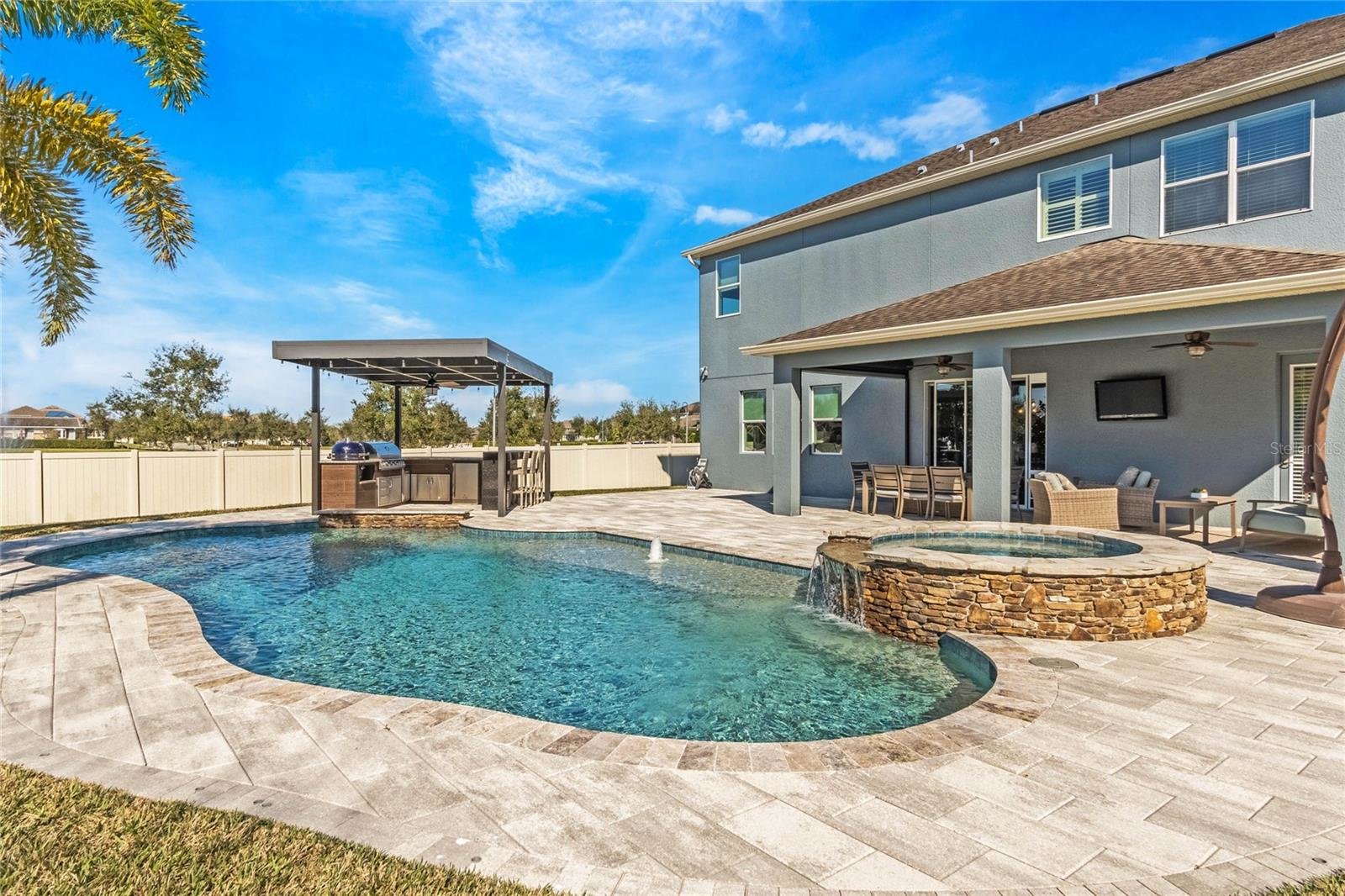In-ground pool in backyard of Hickory Hammock home